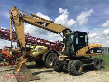 Grävmaskin på däck CATERPILLAR M315C